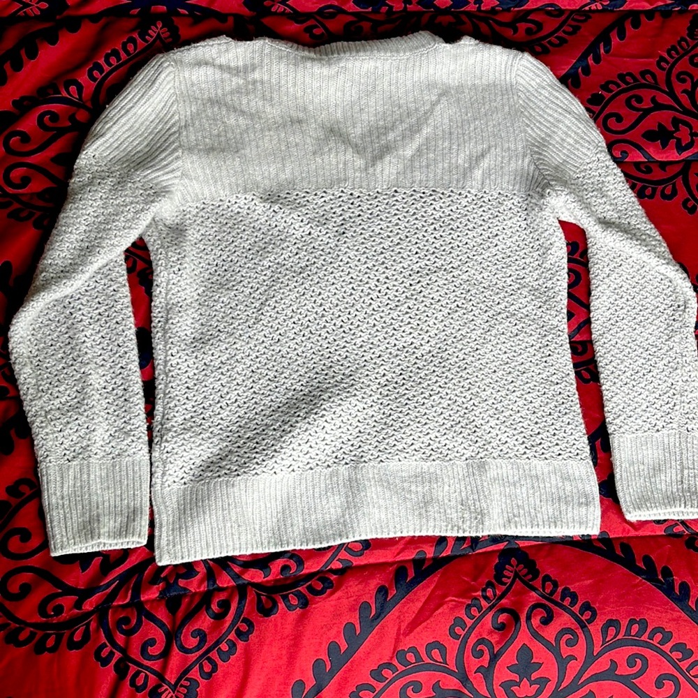 Cute lightly used sweater, with attached wrap around neck! No stains or tears.